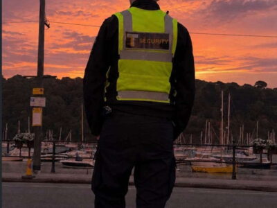 Tier 1 Solutions security officer on the embankment at sunset, Dartmouth Royal Regatta